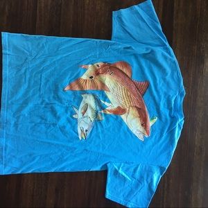 Blue Guy Harvey T-Shirt with Red fish on the back.